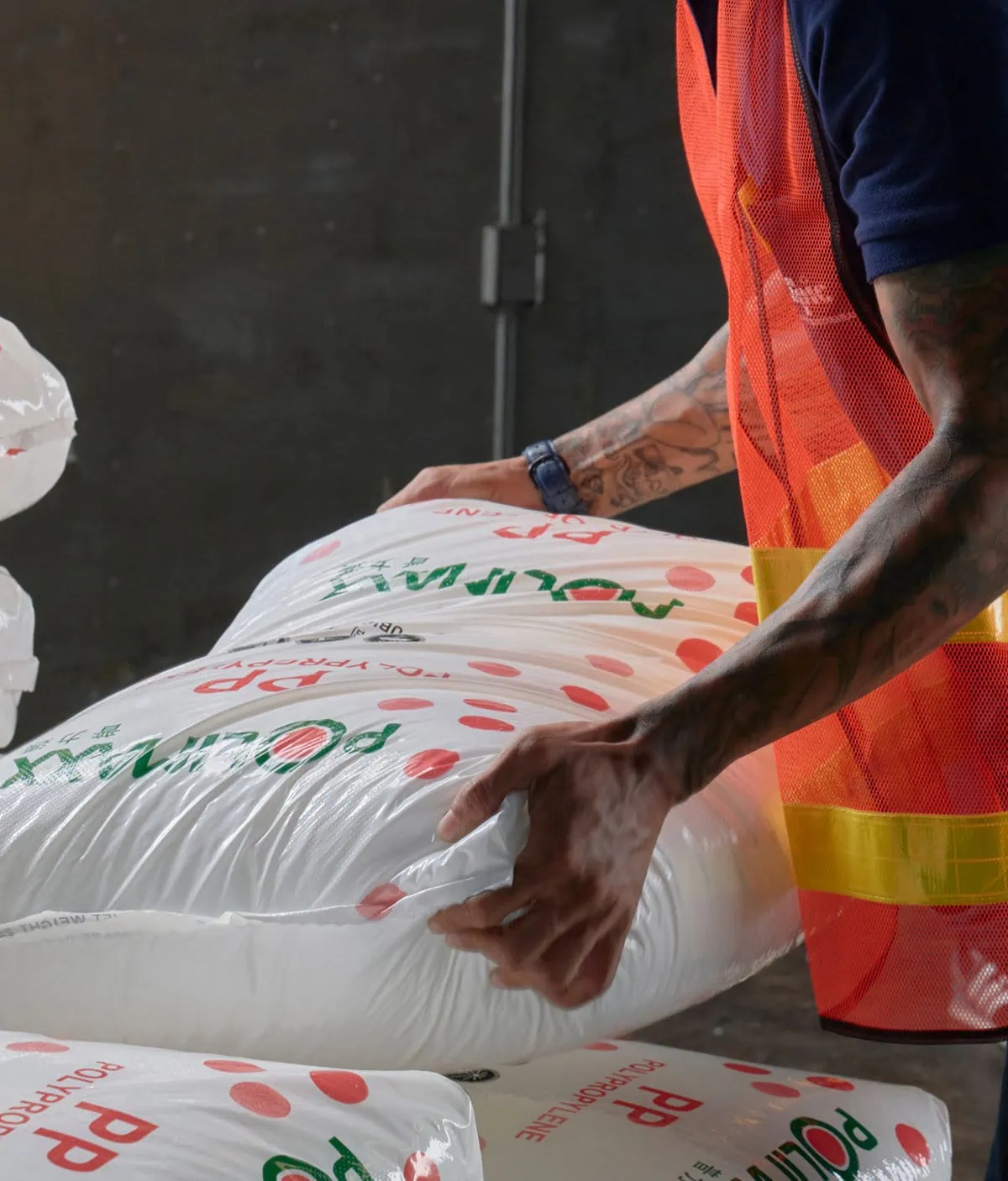 The man who pikc up the bag of polyethylene